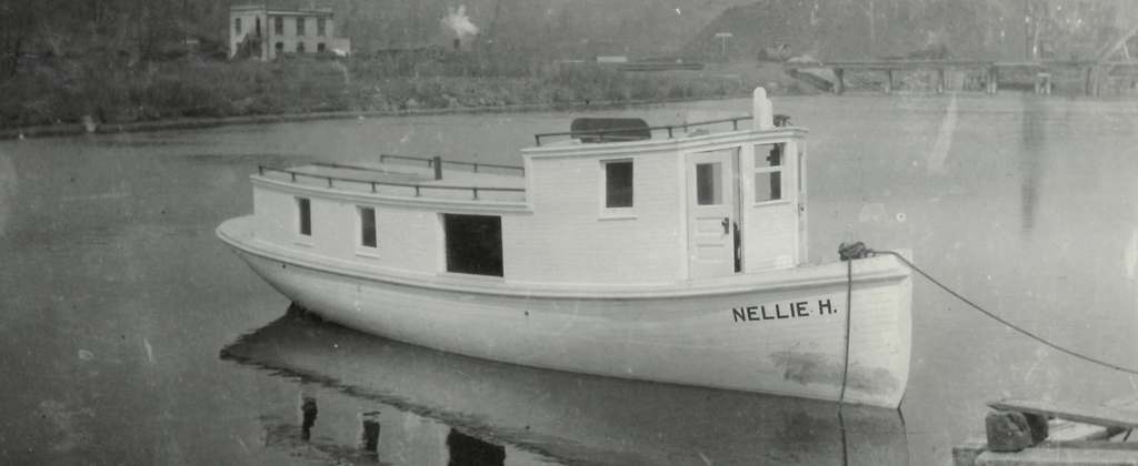 Image of NELLIE H. sitting in river