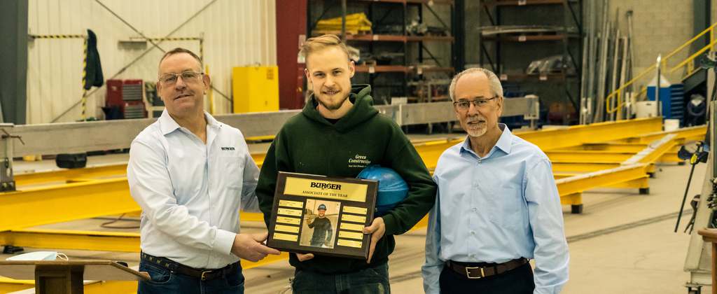 Image of Jason Conant accepting award from Jim Ruffolo and Kurk Anderson