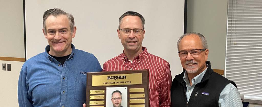 Image of Jason Allard accepting award from Ted Young and Jim Ruffolo