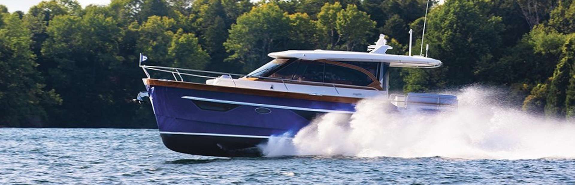 Image of Blue Boat Home Cruising Over Water