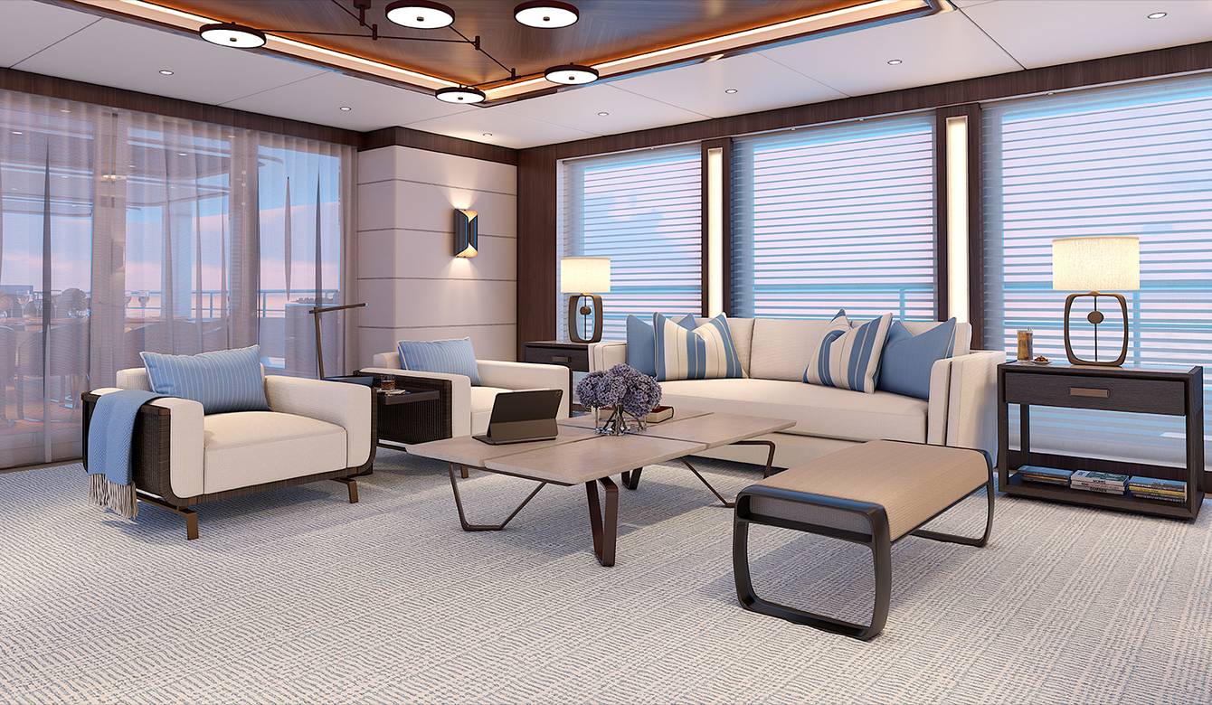 View of seating area with large windows in background