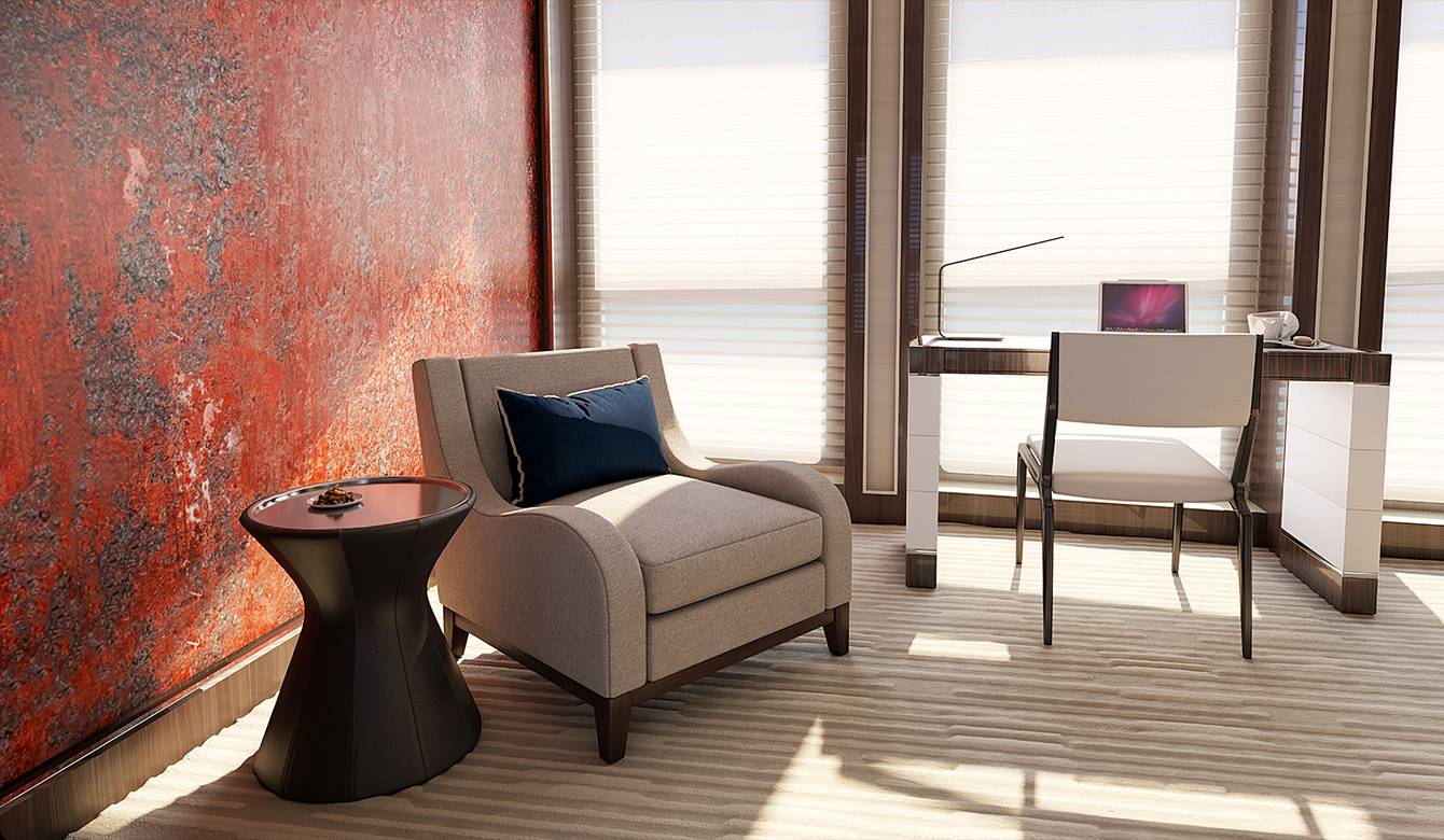 View of chair and desk by large windows